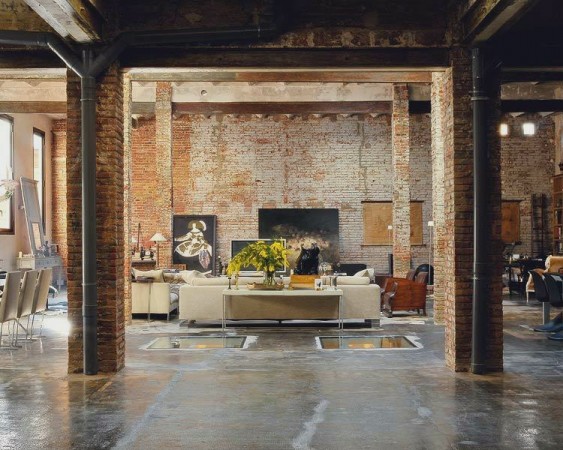 A warehouse to home conversion featuring a living room in an old industrial building.