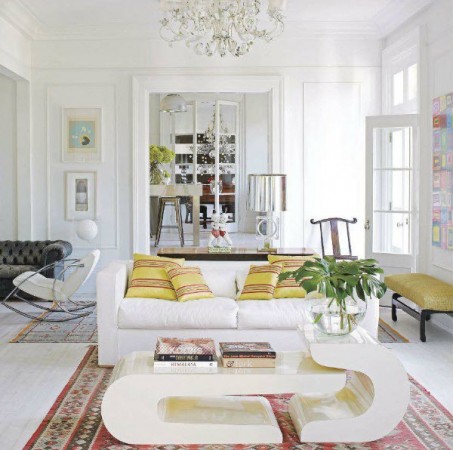 A white couch in a bold living room.