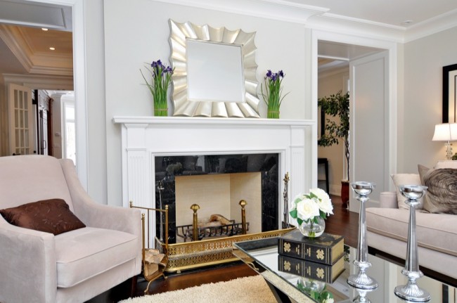 Staging your home with a living room featuring a fireplace and mirror.