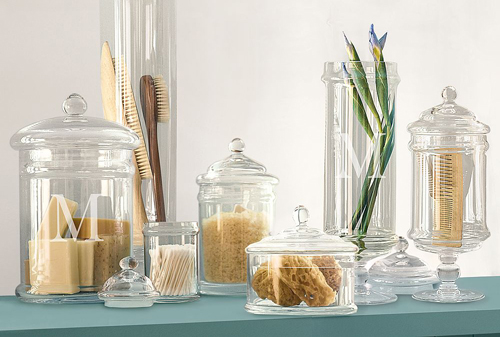 Glass jars on a table for staging your home.