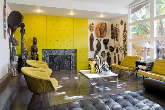 A living room with a vibrant yellow wall.
