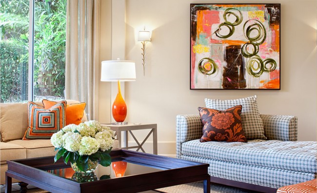A living room with a large painting on the wall that enlivens your home.