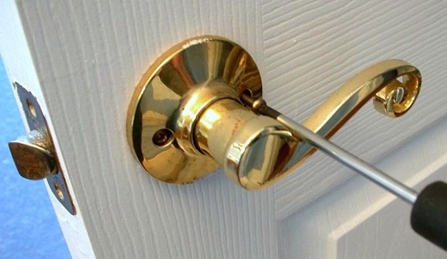 A door with a gold handle for staging your home.