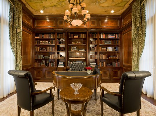 A traditional office with plenty of great shelving 