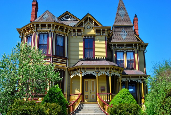A yellow victorian house blending modern style and classic architecture.