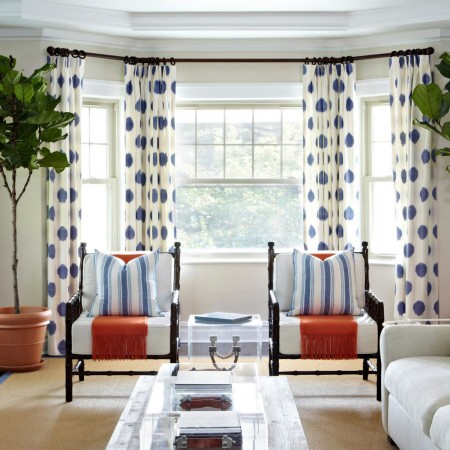 Polka dot curtains frame the room and add character