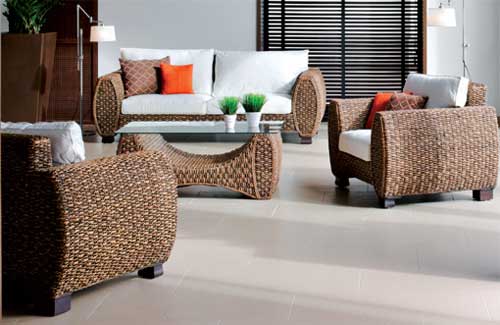 A living room with rattan furniture for an indoor space.