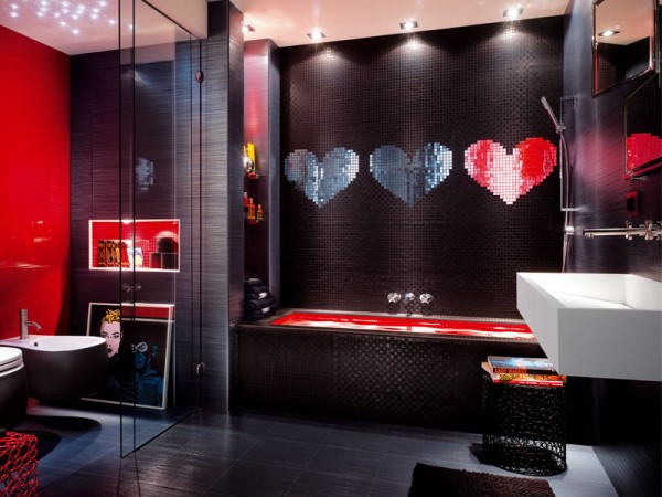 A boldly stylish bathroom with red and black walls.