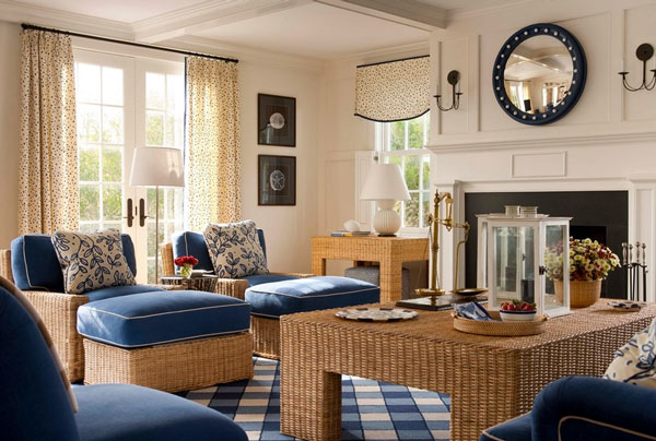 A blue and white living room with rattan furniture.