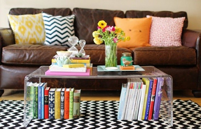 A stylish living room with a coffee table and books on it.