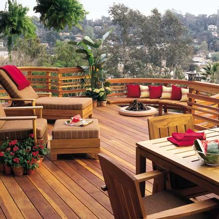 Making the Most of Your Backyard Deck with furniture and a fire pit.