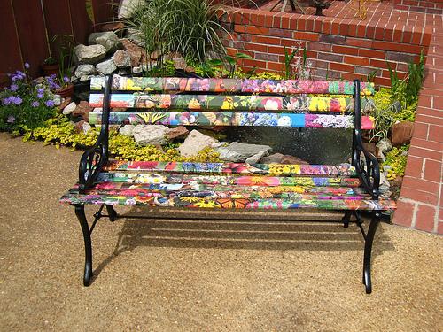 A custom painted bench is the perfect piece to accent the garden 