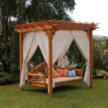 A swing bed with a white canopy.