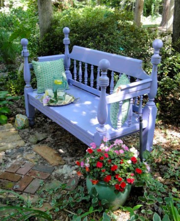 A charming bench made from a repurposed bed frame