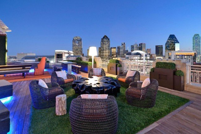 A lovely grassy area for this rooftop outdoor living area