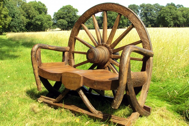 A wagon wheel garden bench 