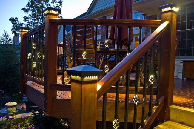 Making the Most of Your Backyard Deck with a wooden railing.