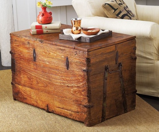 A trunk serves as a side table and extra storage space
