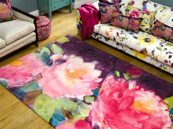 A vibrant watercolor floral rug adds charm to a living room.