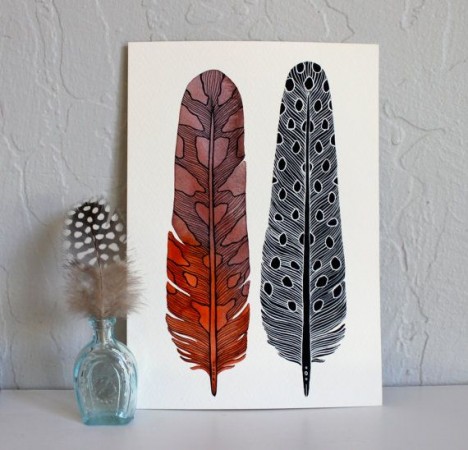 A print of two feathers on a white background for Feather Your Nest.