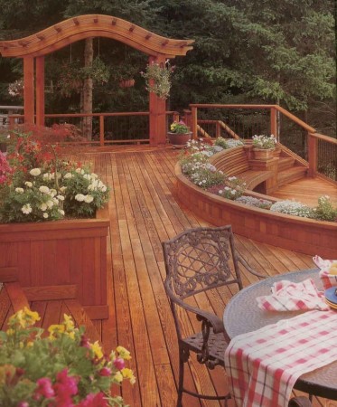 A deck adorned with colorful flowers adds vibrancy to your backyard.