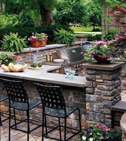Including an outdoor kitchen and bar is the perfect entertaining option