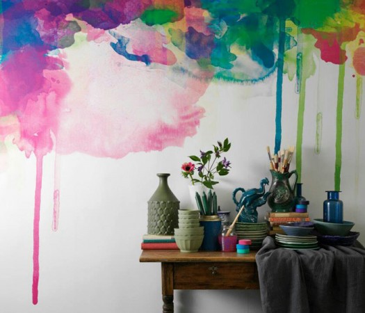 A vibrant watercolor painting adorns a wall next to a table, adding artistic flair to your home.