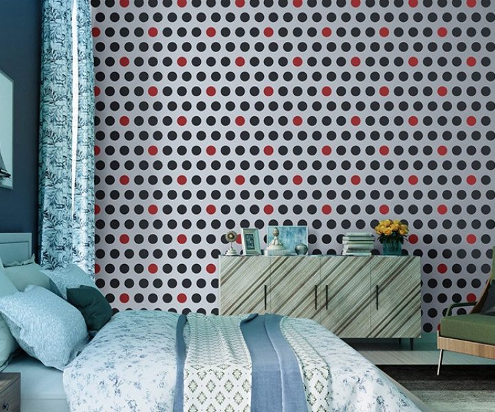 Modern bedroom, polka dot wallpaper, stylish furnishings.
