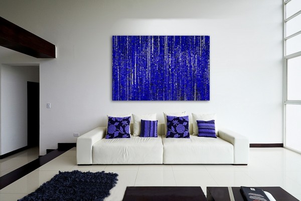 A stylish living room with a blue painting on the wall.
