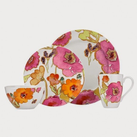 A colorful dinnerware set with a watercolor design.