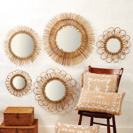 A group of rattan mirrors for an indoor space.