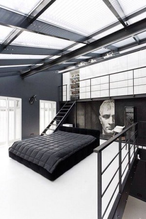 A black and white bedroom with a bed.