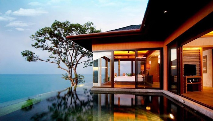 A house with a pool overlooking the ocean - Splendid Room Designs.