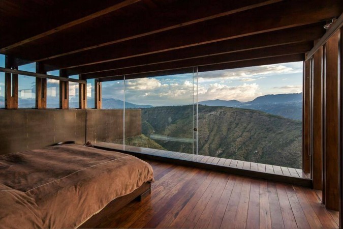 A bedroom with a view of the mountains that will give you a reason to redesign your room.