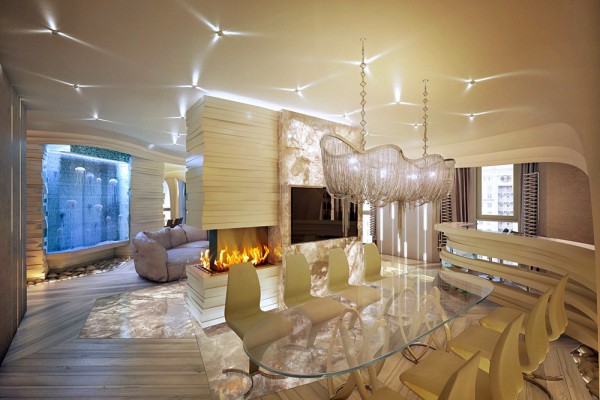 A modern dining room with ocean accents and a fireplace.