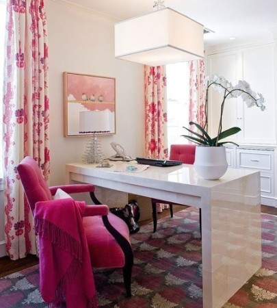 Home office design tips for her: a pink office with a white desk.