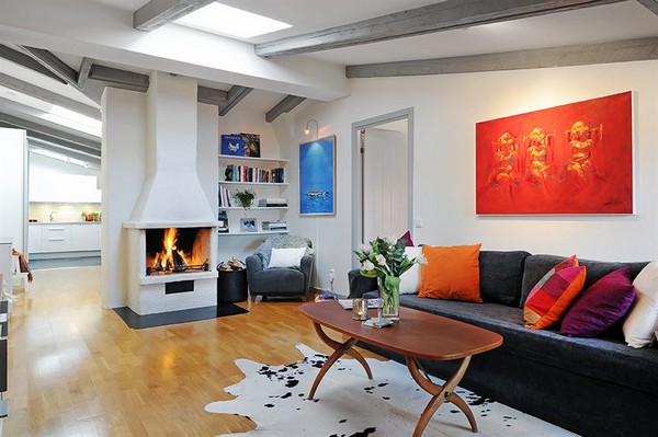 A living room with a fireplace and a cowhide rug featuring design inspiration from Scandinavian style homes.