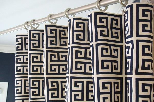 A shower curtain featuring a Greek key design.