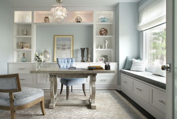 A home office with light blue walls and white furniture designed for her.