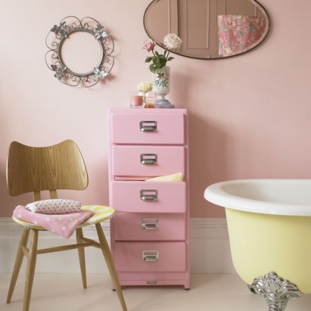 How To Create The Perfect Pastel Bathroom with pink walls and a bathtub.