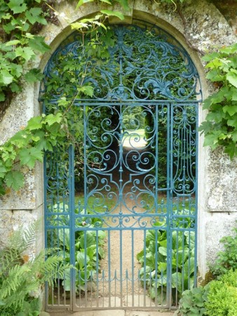 Iron scrollwork garden gate