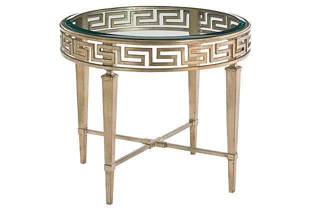 A round table with a Greek key design.