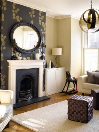 The fireplace wall stands out using a bold and black wallpaper (pinterest.com)