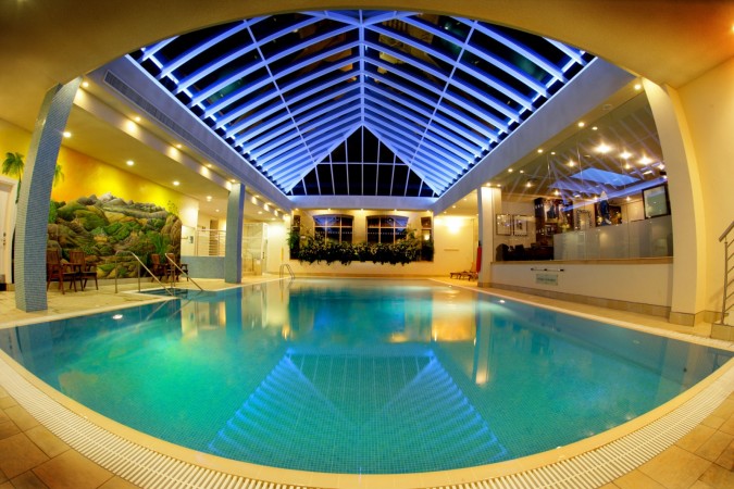 An inspiring indoor swimming pool at night.
