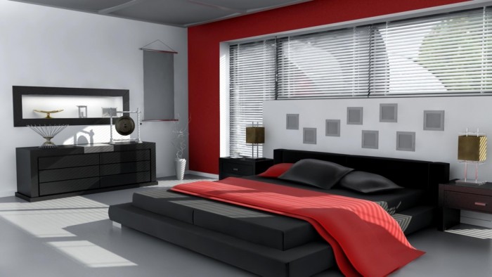 Bold red accents soften the monochrome and add another level to this bedroom (telecomwiz.com)