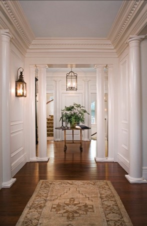 The style of the sconce mirrors that of the front hallway pendant light