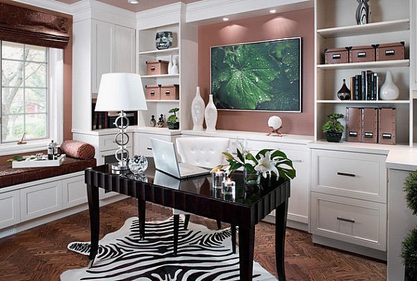 A home office with a vibrant desk and stylish zebra print rug, perfect for her.