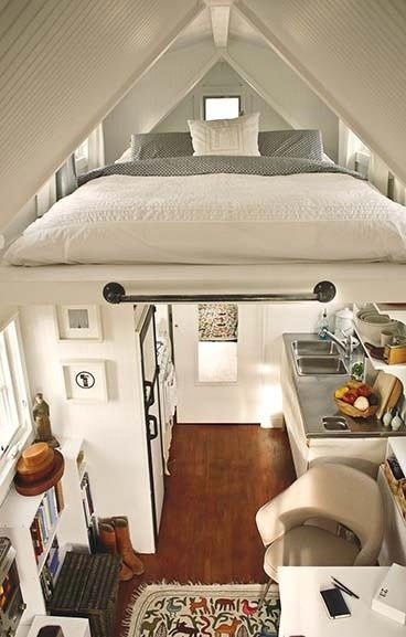 A space-saving lofted bedroom in a tiny house.