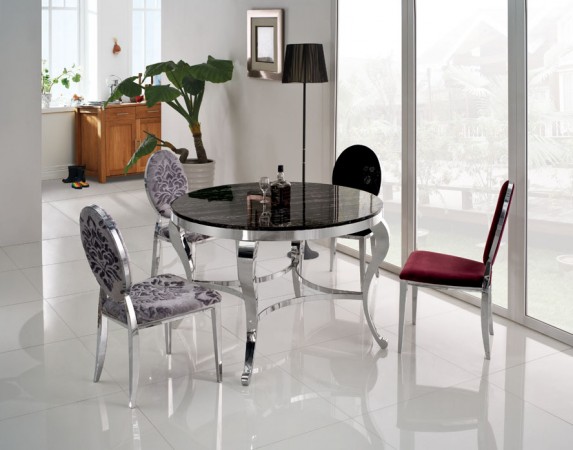 A round dining room table with chairs.