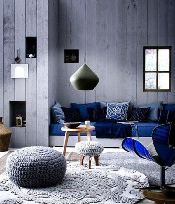 A modern living room with blue and white colors.